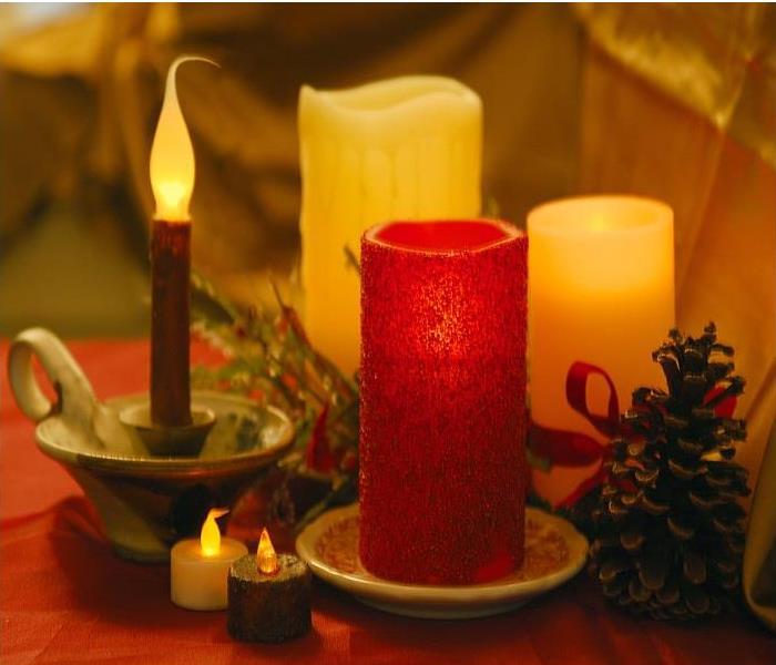 two white flameless candles, red flameless candles and 1 and 1 dark flameless candle stick