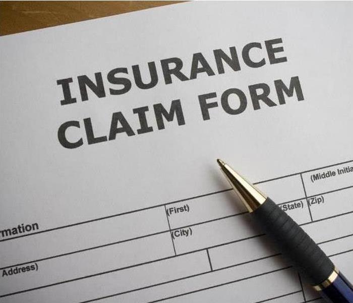 white paper with the words insurance claim form