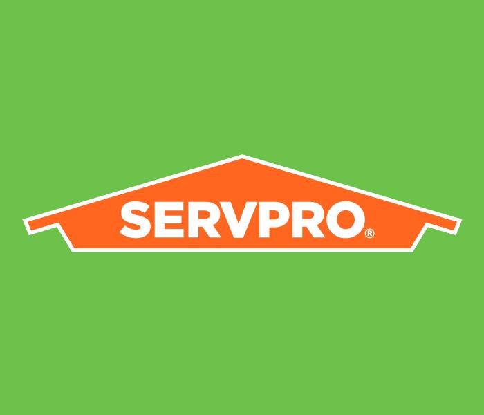 logo green background orange house with SERVPRO in white letters