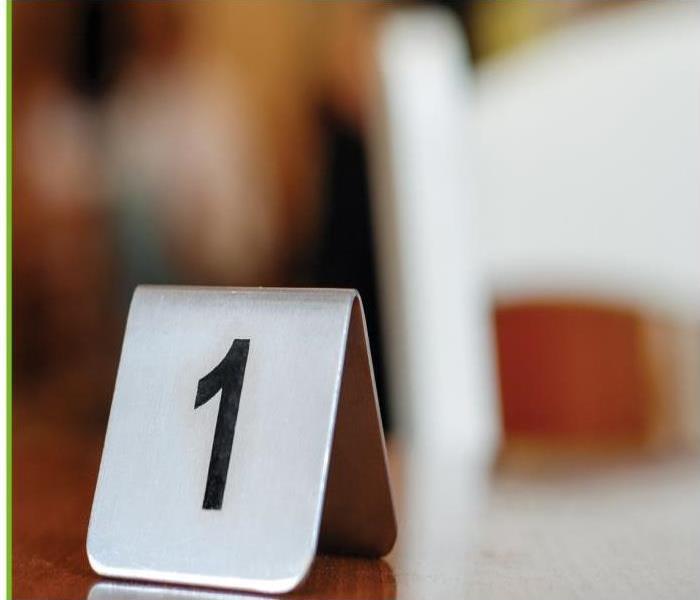 Blurry background showing table number siting on the table.