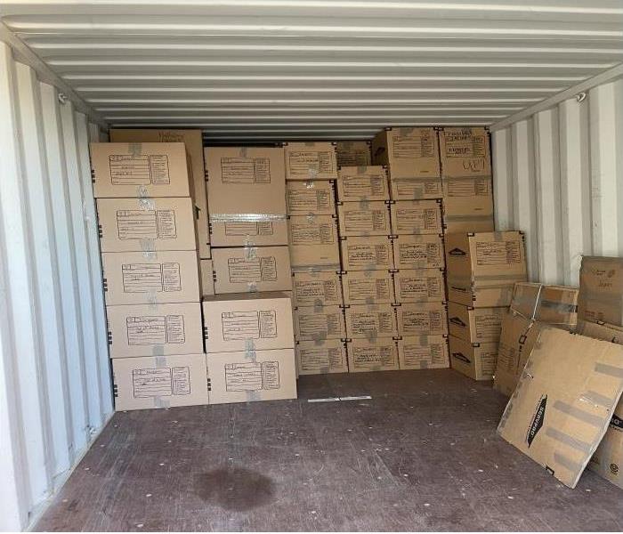 container filled with brown boxes