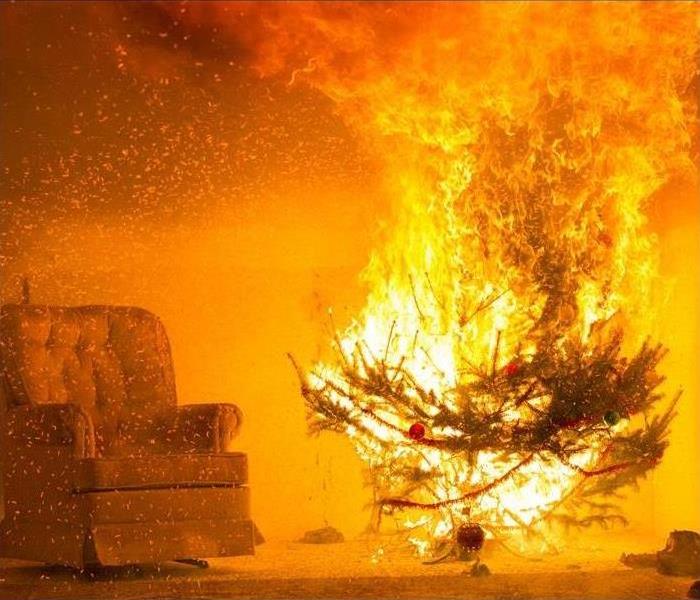 Christmas pine tree on fire with red and orange flames