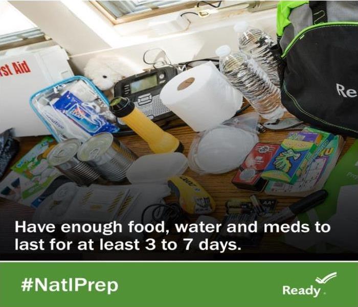 emergency supplies on a table with the words, "Have enough food, water and meds to last for at least 3-7 days."